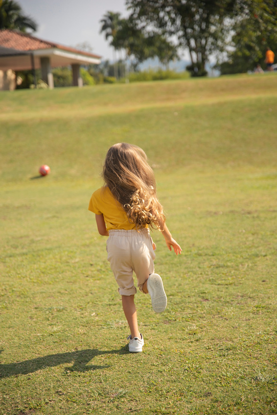 Girl Running at the Field